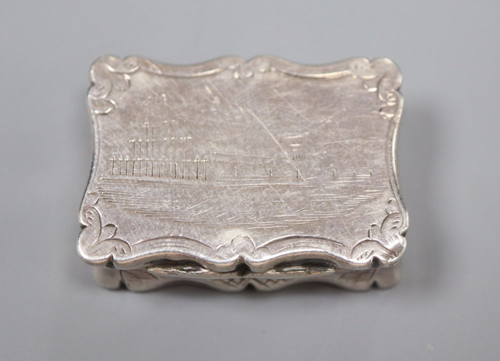 A Victorian silver vinaigrette, by Thomas Dones, engraved with a scene of the Crystal Palace, Birmingham, 1850, 31mm.